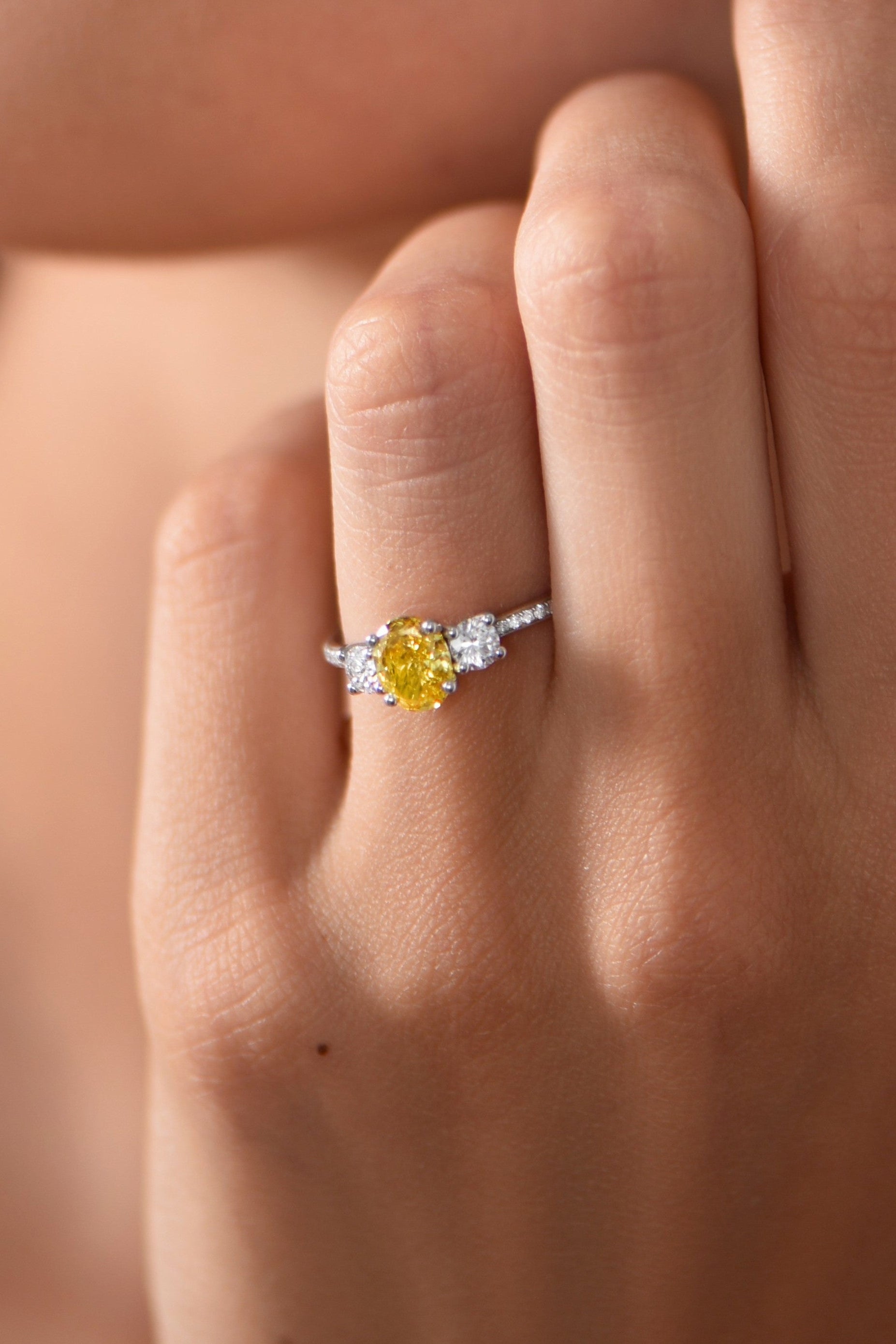 Trilogy ring with yellow diamond