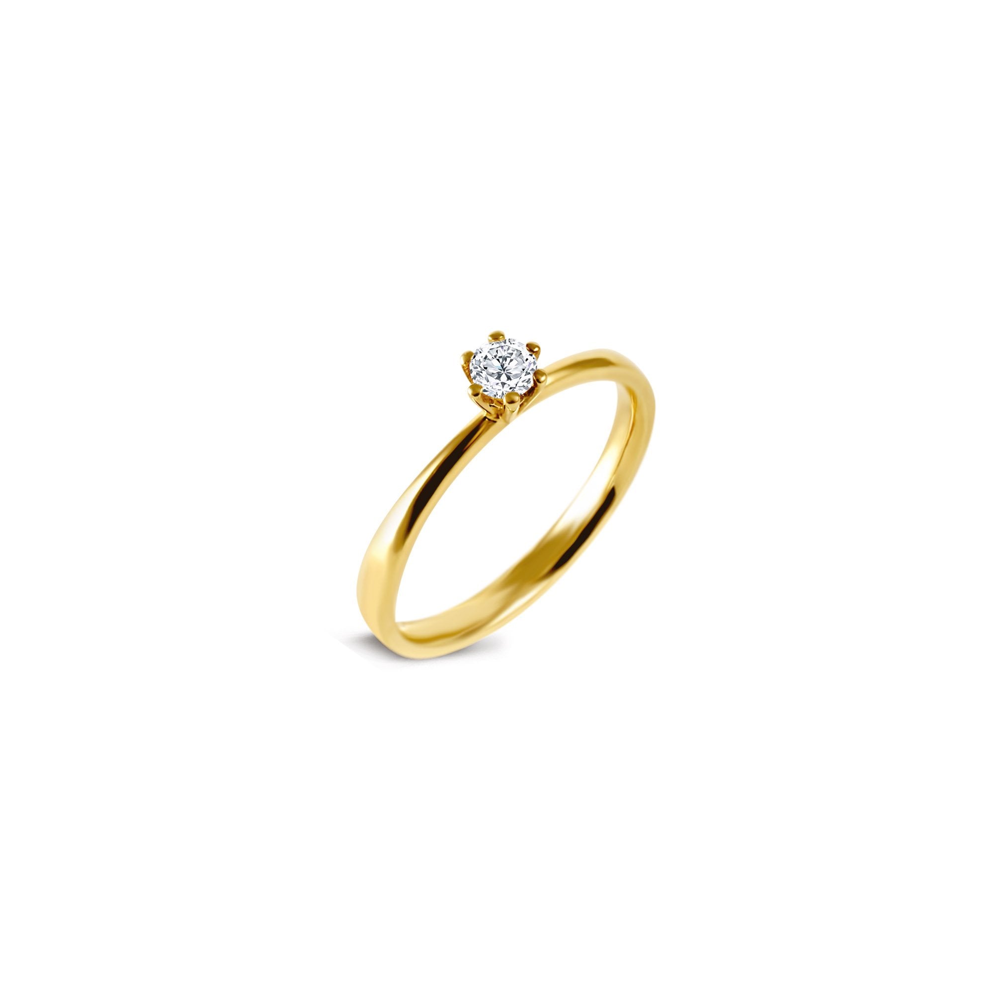 Ce solitaire classique aux lignes épurées est orné d'un simple diamant central taille brillant de 0.25